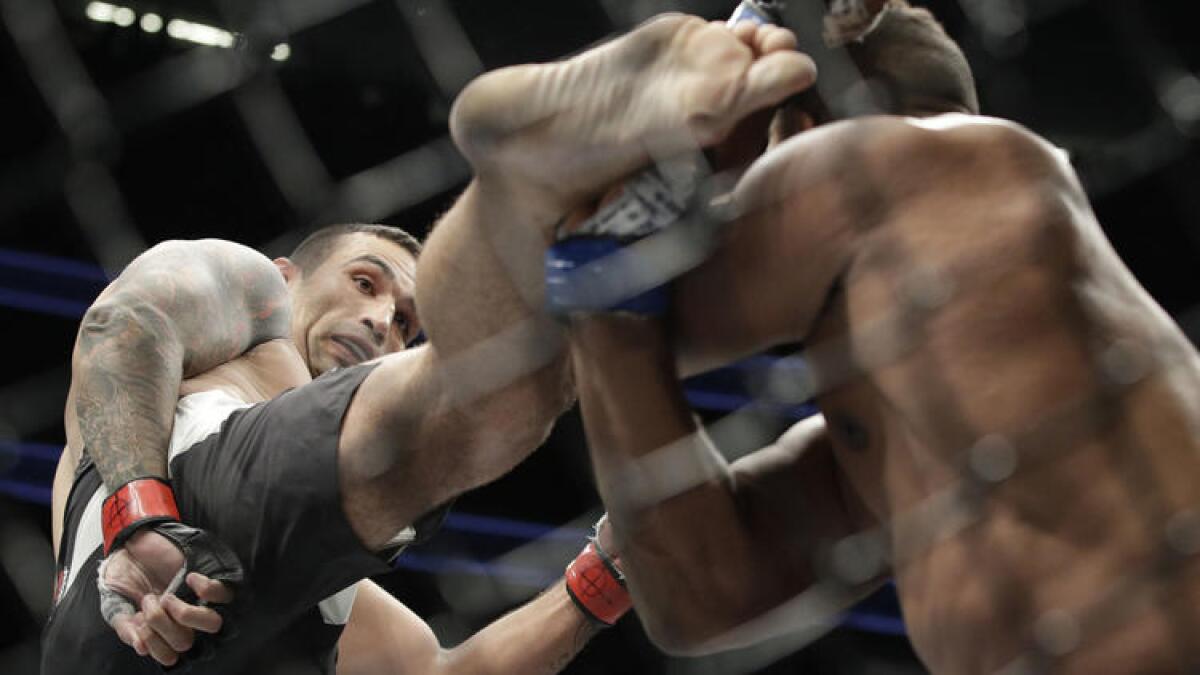 Fabricio Werdum lands a kick against Alistair Overeem during their heavyweight fight at UFC 213.