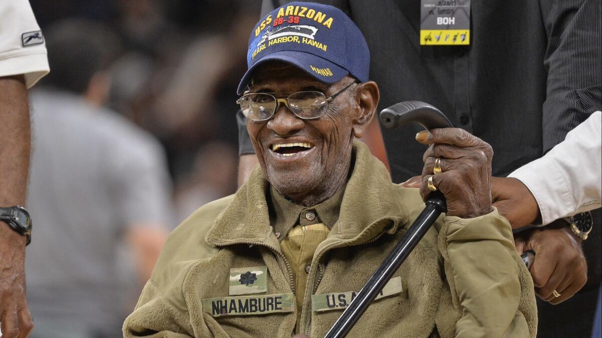 Richard Overton leaves the court ion March 23, 2017, after a special presentation honoring him as the oldest living American war veteran, during an NBA game between the Memphis Grizzlies and the San Antonio Spurs.