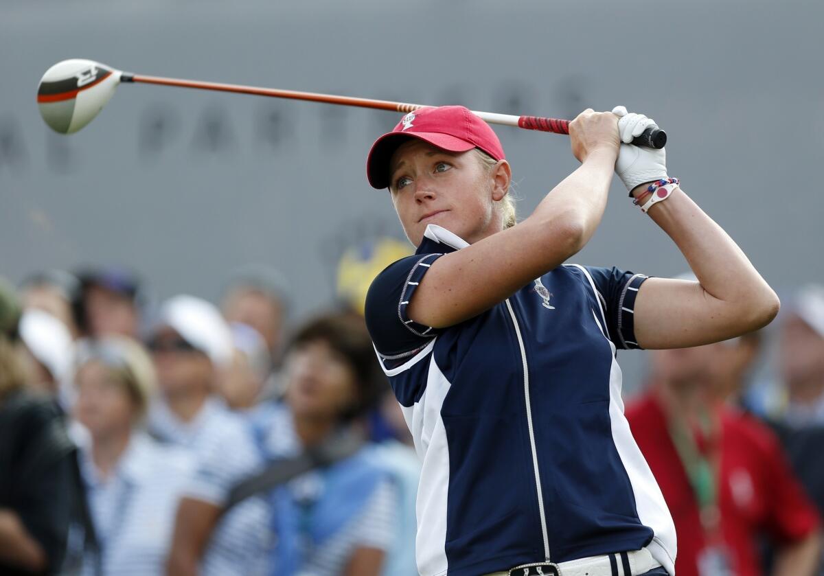 Stacy Lewis of the United States tees off on the first hole at the Solheim Cup golf tournament on Friday.