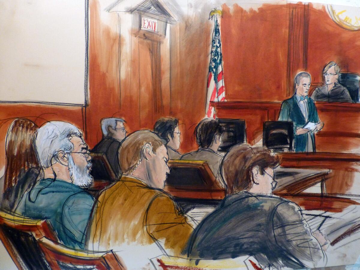 In this artist's sketch, radical Muslim cleric Abu Hamza Masri, left, sits in court as the verdict is read in his terrorism trial in New York on May 19.