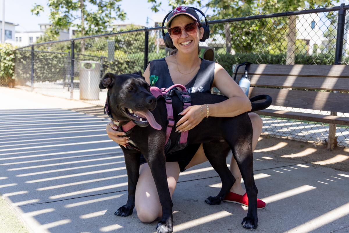 Arielle Bernstein with foster dog Jane Doe at Bluff Creek Dog Park.