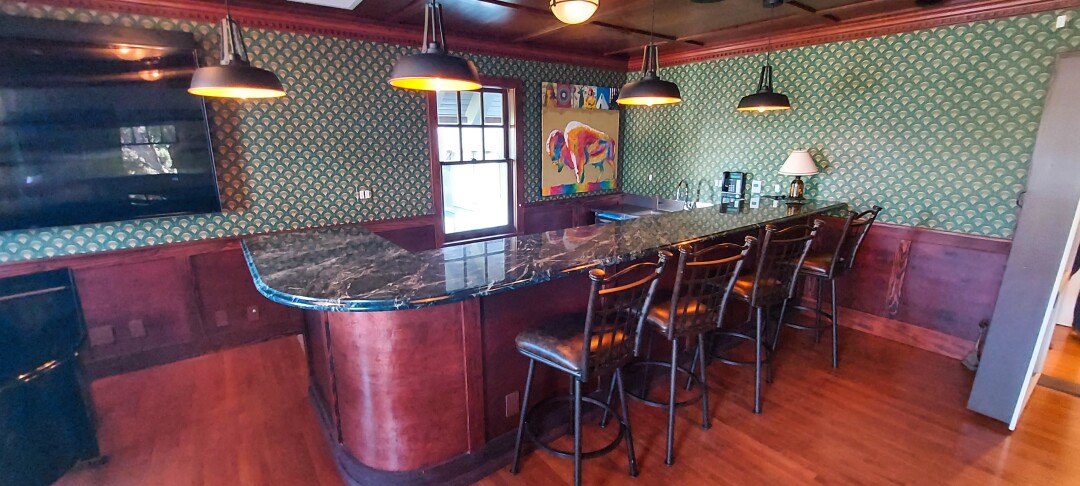 Push down on a shelf to reveal this hidden underground bar at Crown Manor in Coronado.