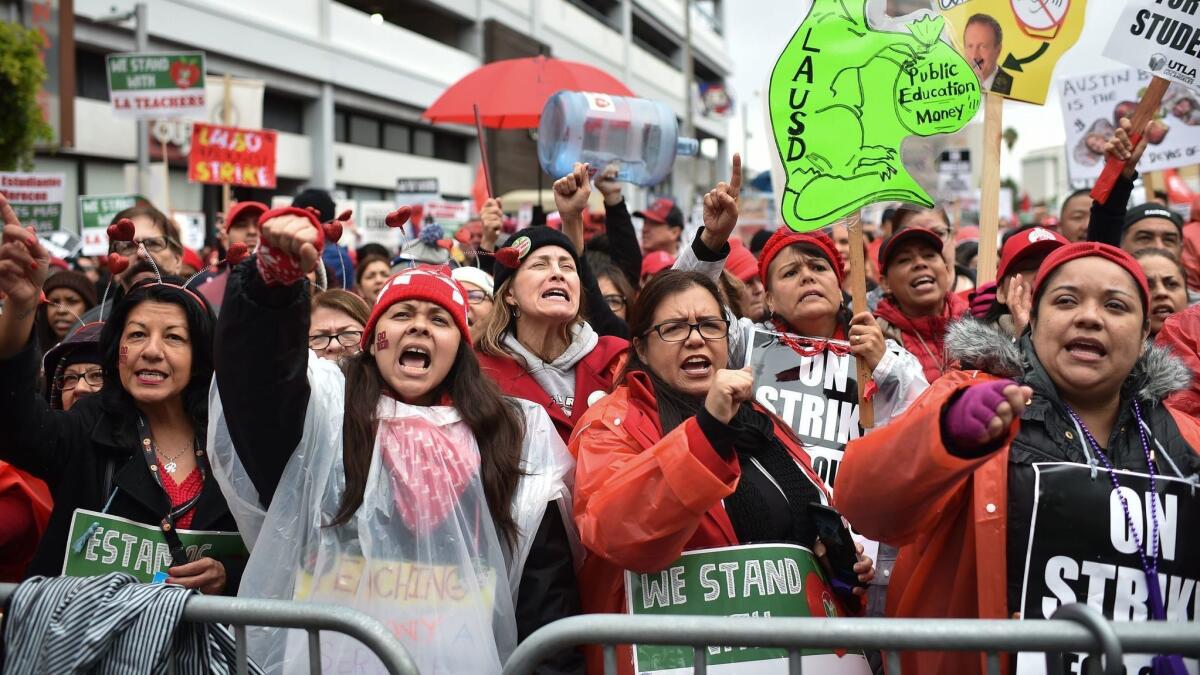 Striking teachers and their supporters march on the downtown L.A. headquarters of the California Charter Schools Assn. on Jan. 15, during the recent teachers strike. Union leaders have called for a moratorium on new charters.