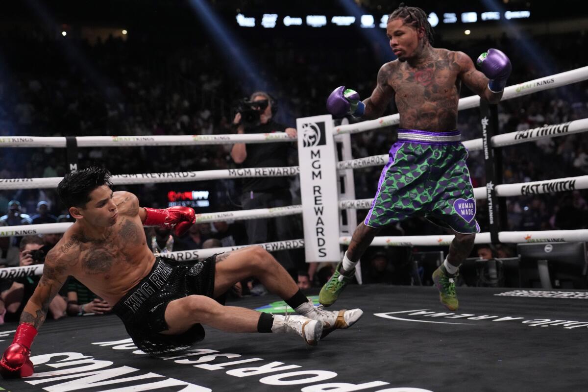 Gervonta Davis knocks down Ryan Garcia during their lightweight bout at T-Mobile Arena.