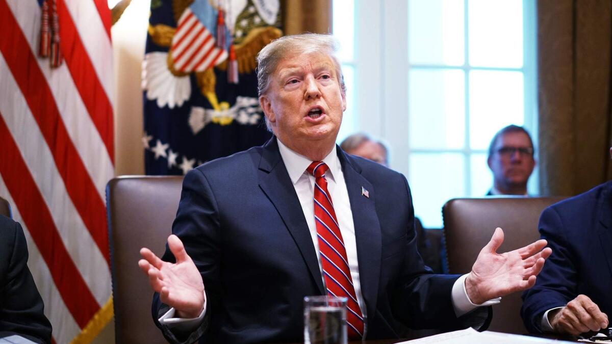 President Trump speaks at a Cabinet meeting Feb. 12.