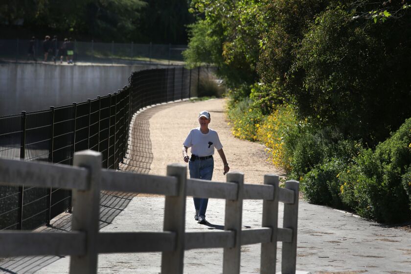 Jerry Beber walks along the Los Angeles River North Valleyheart Riverwalk in Los Angeles.