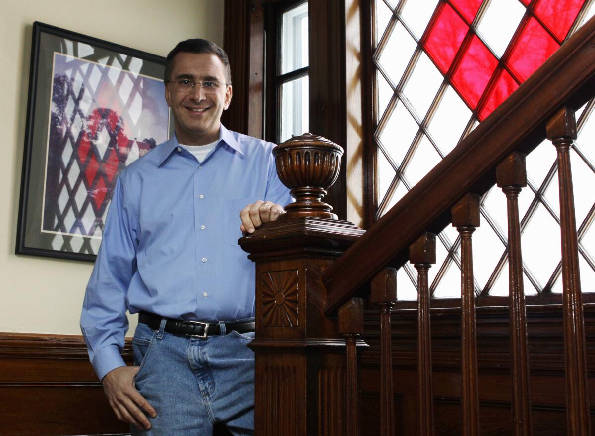 Man in the hot seat: In this Feb. 8, 2011 file photo, Jonathan Gruber poses in his home in Lexington, Mass.