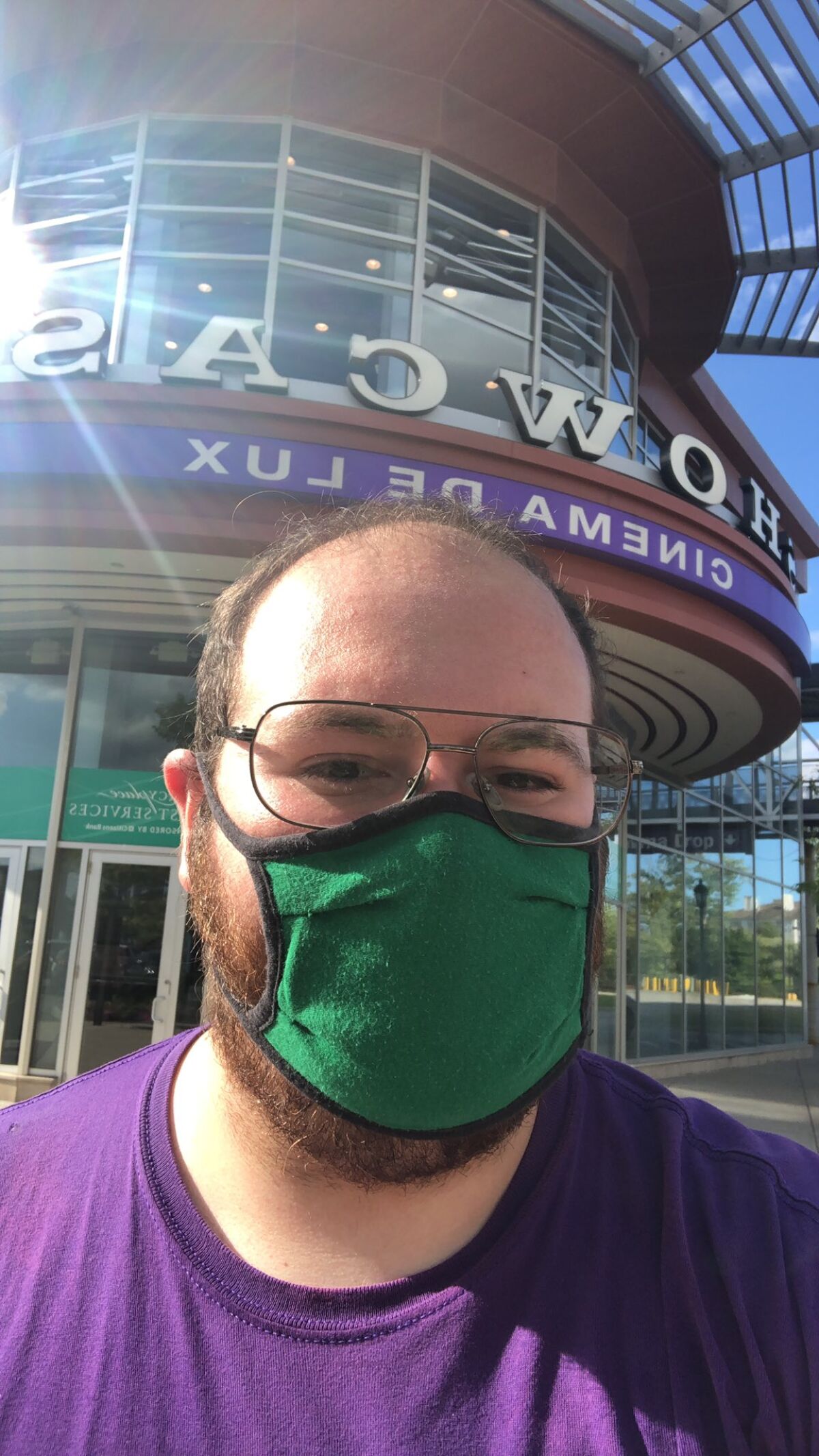 Henry Perno snaps a selfie in front of the Showcase Cinema de Lux in Dedham, Mass.