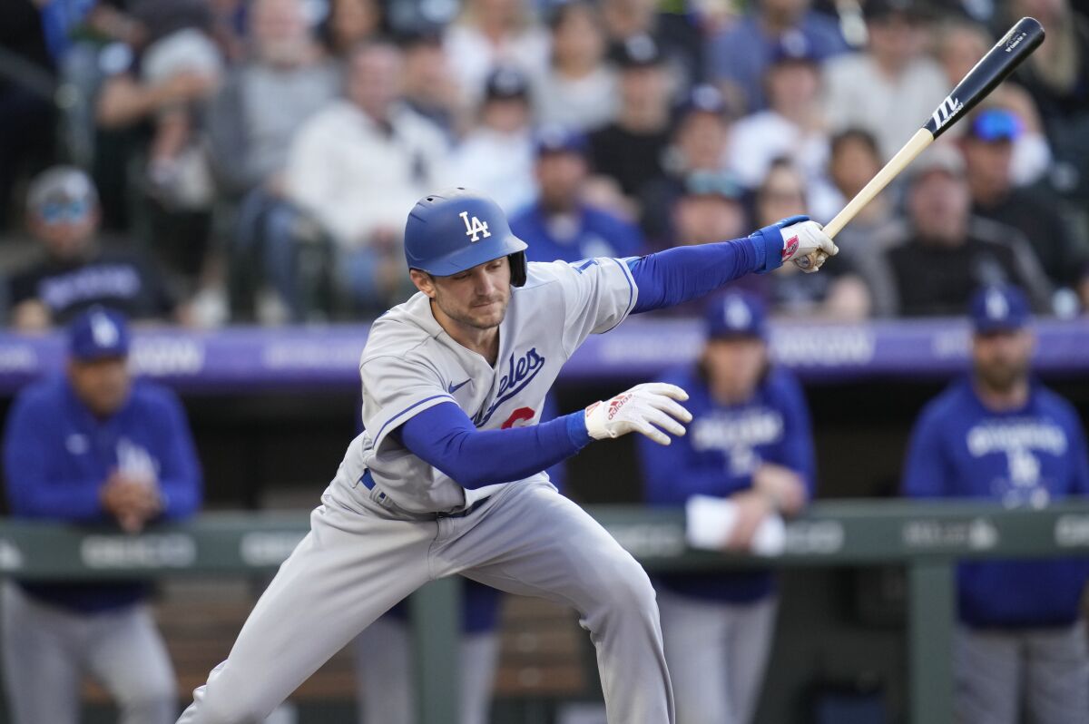 Dodgers shortstop Trea Turner swings at a pitch during a loss to the Colorado Rockies on Saturday.