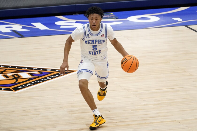 Memphis guard Boogie Ellis dribbles the ball during a game