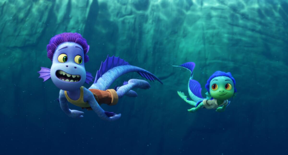 Two sea monster boys swimming underwater 