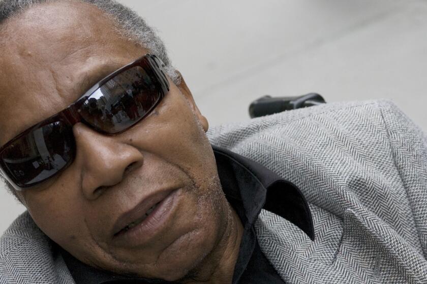 FILE - This Nov. 2, 2007 file photo shows Frank Lucas, the man Denzel Washington portrayed in the film "American Gangster," in New York. The Harlem drug kingpin whose life became the basis for the 2007 movie American Gangster has died. Frank Lucas was 88. His nephew Aldwan Lassiter confirms Lucas died Thursday, May 30, 2019 in New Jersey, where he had lived for years. (AP Photo/Jim Cooper, File)