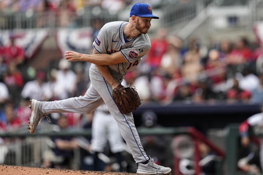 New York Mets pitcher Tyler Jay (74) delivers during the nineth inning inning of a baseball game against the Atlanta Braves, Thursday, April 11, 2024, in Atlanta. (AP Photo/Mike Stewart)