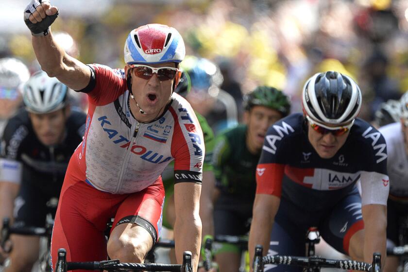 Alexander Kristoff of Norway celebrates as he crosses the finish line to win the 15th stage of the Tour de France on Sunday in Nimes, France.