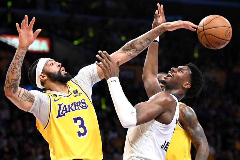 Los Angeles, California April 28, 2023-Lakers Anthony Davis blocks the shot of Grizzlies Jaren Jackson Jr.
