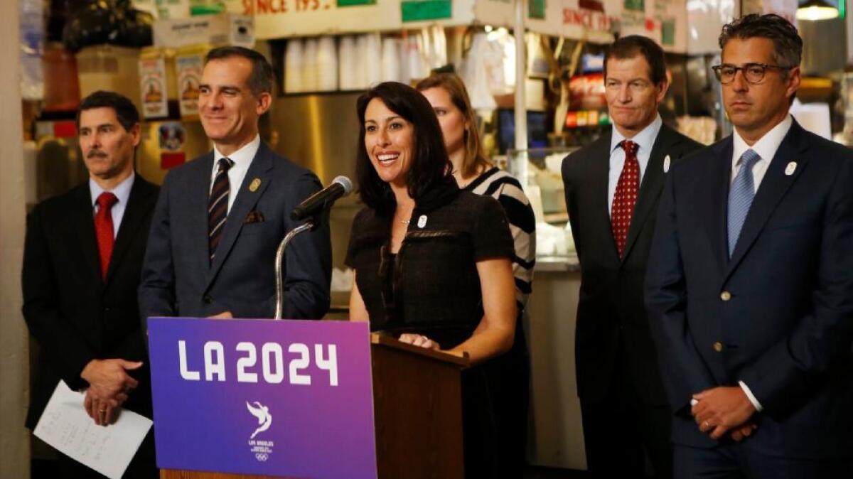 LA 2024 Candidature Committee Vice Chair Janet Evans speaks at podium during a news conference on Jan. 9 forecasting the economic activity that would happen if Los Angeles ends up hosting the 2024 Games.
