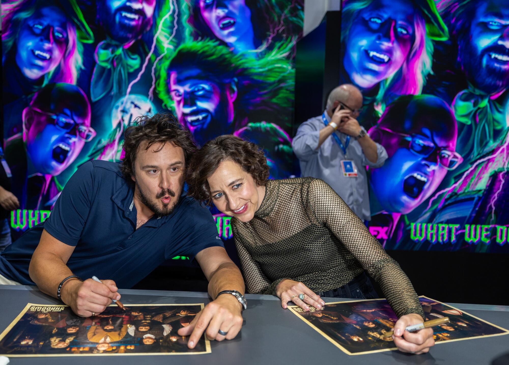 Actress Kristen Schaal, right, as "The Guide"poses for a photo with Kyle Newacheck.