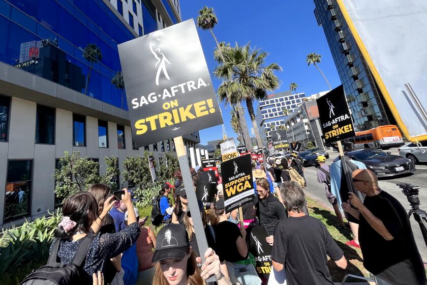 SAG / AFTRA members picket outside of Amazon Studios in Culver City on Friday, July 14, 2023, on first day of the union's strike. On Thursday, SAG-AFTRA board members voted unanimously to call a strike against the studios - the first such walkout in 43 years.