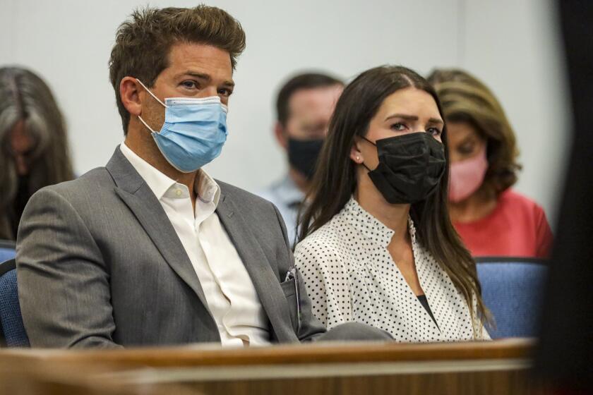 Santa Ana, CA - August 19: Newport Beach doctor, Grant Robicheaux, and his girlfriend, Cerissa Riley, who are charged with drugging and sexually assaulting several women, at a pre-trial hearing at Superior Court of California of the County of Orange on Thursday, Aug. 19, 2021 in Santa Ana, CA. (Irfan Khan / Los Angeles Times)