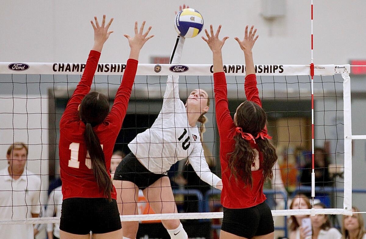 JSerra senior Reese Brown hits through an Orange Lutheran block during the Division 2 final Saturday at Cerritos College.