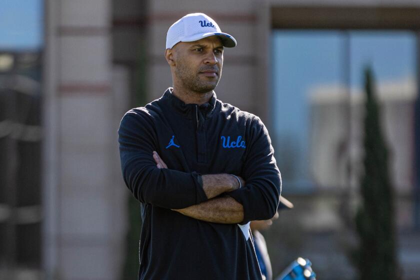 UCLA defensive coordinator D'Anton Lynn watches players during a recent practice session. April 2023.