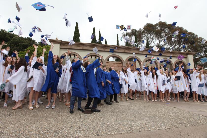 The La Jolla Country Day School class of 2023 throws their caps in the air following the graduation ceremony June 2.