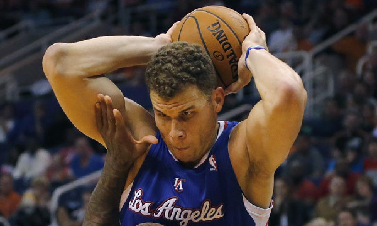 Clippers power forward Blake Griffin controls the ball against the Suns in Phoenix.