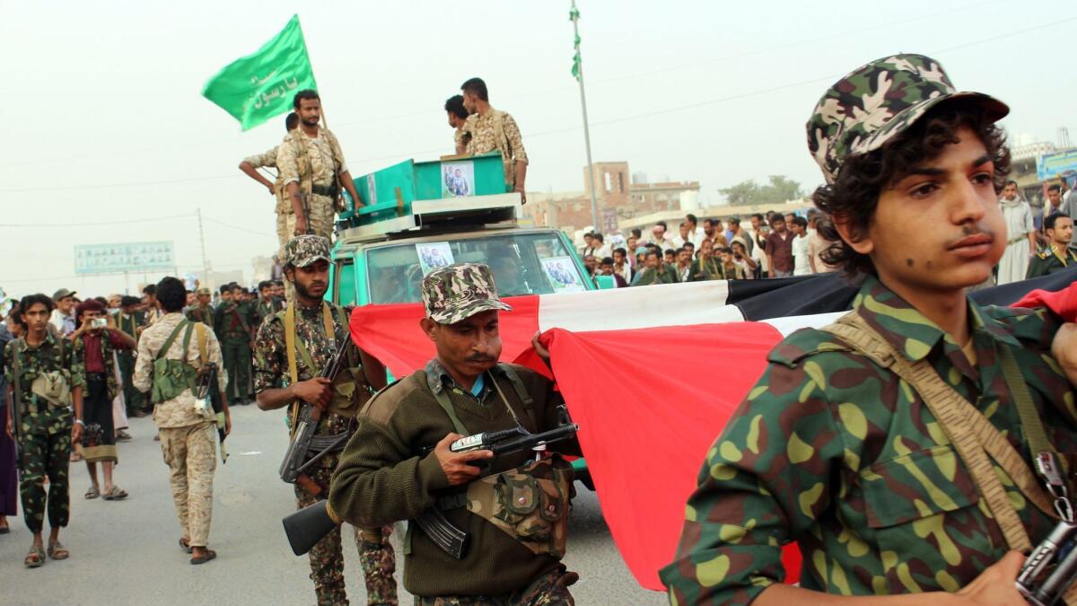 Supporters march during a funeral of a Houthi leader in the district of Midi, in the Hajjah governorate, near the border with Saudi Arabia, on Jan. 13, 2018.