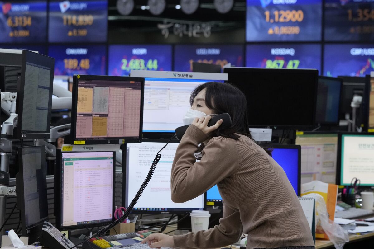 Currency trader on the phone in South Korea.