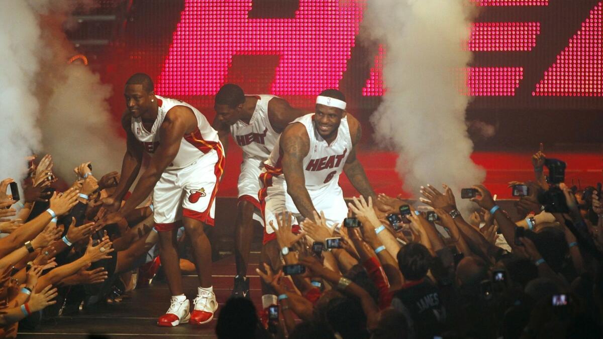 Fans cheer as the Heat introduce their Big Three: Dwyane Wade, Chris Bosh and LeBron James.
