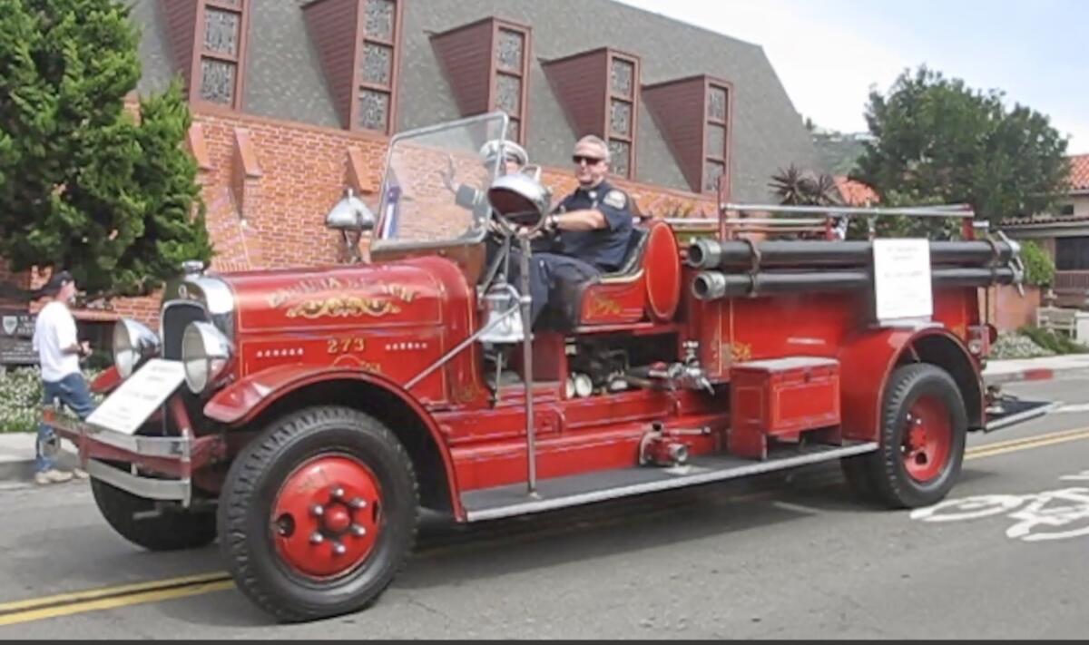 The Laguna Beach fire department's 1931 Seagrave fire engine participates in the 2017 Patriots Day Parade. 