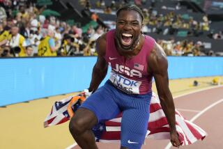 Noah Lyles, of the United States, celebrates after winning the gold medal in the men's 100-meter final during the World Athletics Championships in Budapest, Hungary, Sunday, Aug. 20, 2023. (AP Photo/Matthias Schrader)