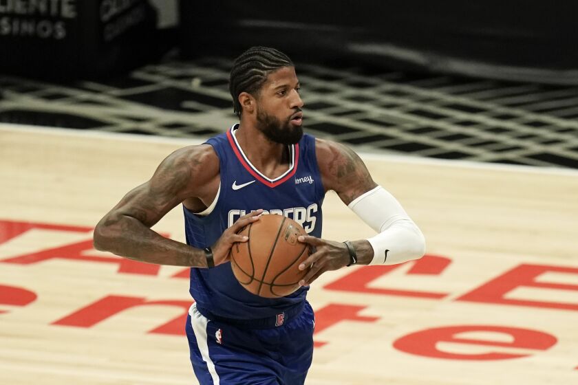 Los Angeles Clippers' Paul George looks to pass the ball during the first half of an NBA basketball game against the Portland Trail Blazers Wednesday, Dec. 30, 2020, in Los Angeles. (AP Photo/Jae C. Hong)