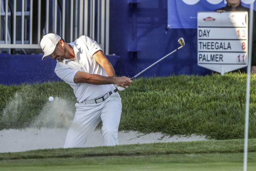 SAN DIEGO, CA - JANUARY 28, 2022: Jason Day hits out of a bunker at the South Course's 18th green during the third round of the Farmers Insurance Open at the Torrey Pines Golf Course in San Diego on Friday, January 28, 2022. (Hayne Palmour IV / For The San Diego Union-Tribune)