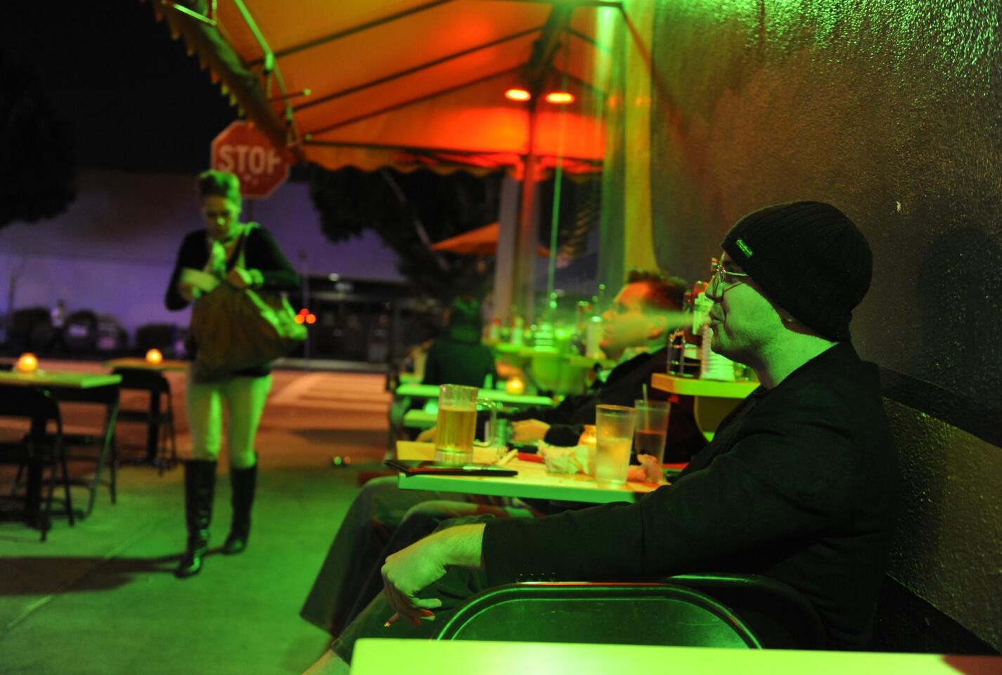 Eric Burke, left, and Nick Herpy enjoy a drink at Fred 62 along Vermont Avenue in Los Feliz.