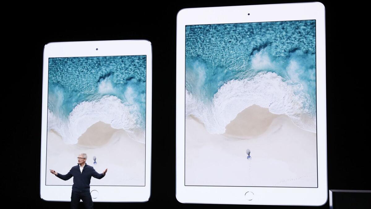 Apple CEO Tim Cook introduces a revamped iPad at an event in New York.