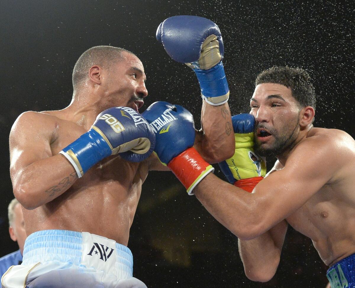 Andre Ward, left, connects against Edwin Rodriguez during a fight at Citizens Business Bank Arena in Ontario on Nov. 16, 2013.