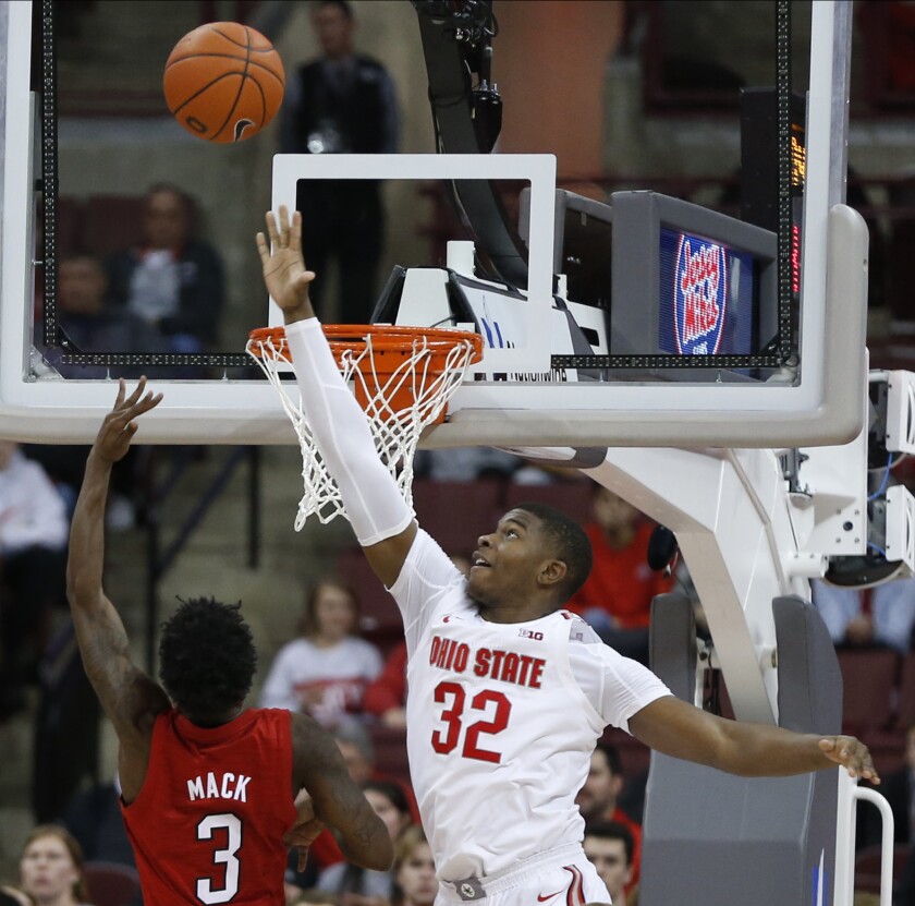 Nebraska's Cam Mack, left, tries to shoot over Ohio State's E.J. Liddell during the second half of an NCAA college basketball game Tuesday, Jan. 14, 2020, in Columbus, Ohio. Ohio State defeated Nebraska 80-68. (AP Photo/Jay LaPrete)