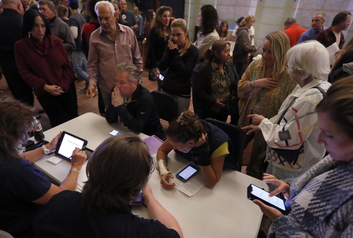 FEMA representatives talk with Malibu residents who were forced to evacuate because of the Woolsey fire.