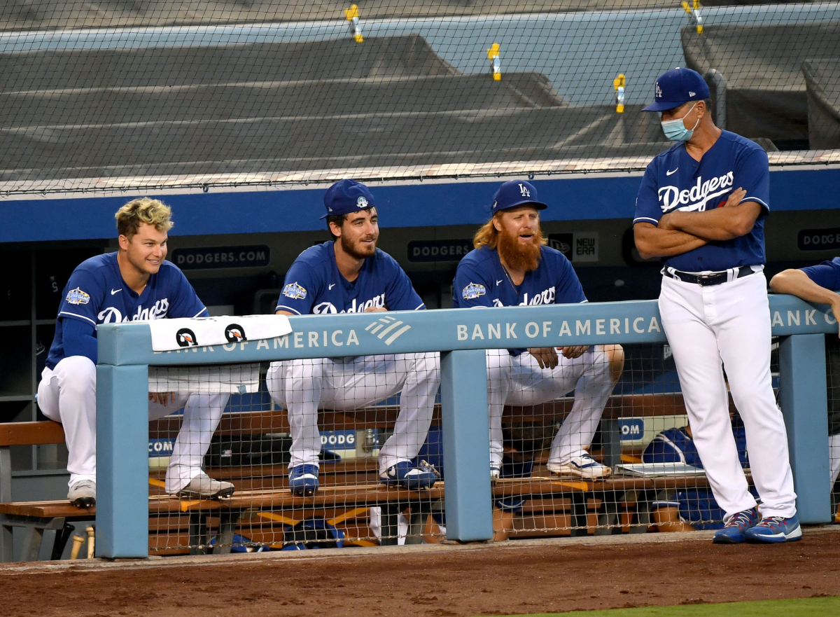 Dodgers teammates Joc Pederson, Cody Bellinger, Justin Turner talk to bench coach Bob Geren.