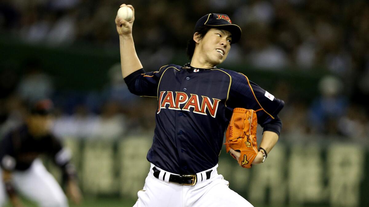 Japan's Kenta Maeda delivers a pitch against the Netherlands during the 2013 World Baseball Classic.