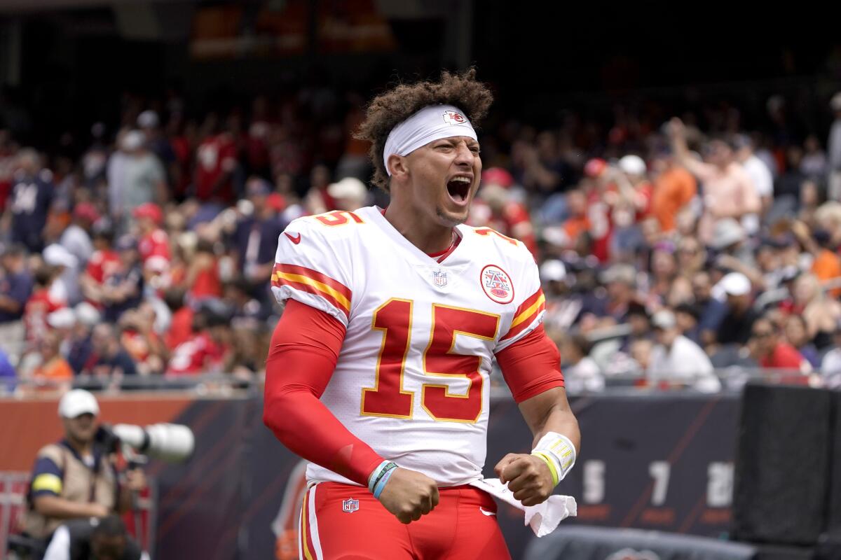 Kansas City Chiefs quarterback Patrick Mahomes gets the Chiefs' fans excited during the first half of an NFL preseason football game against the Chicago Bears Saturday, Aug. 13, 2022, in Chicago. (AP Photo/David Banks)