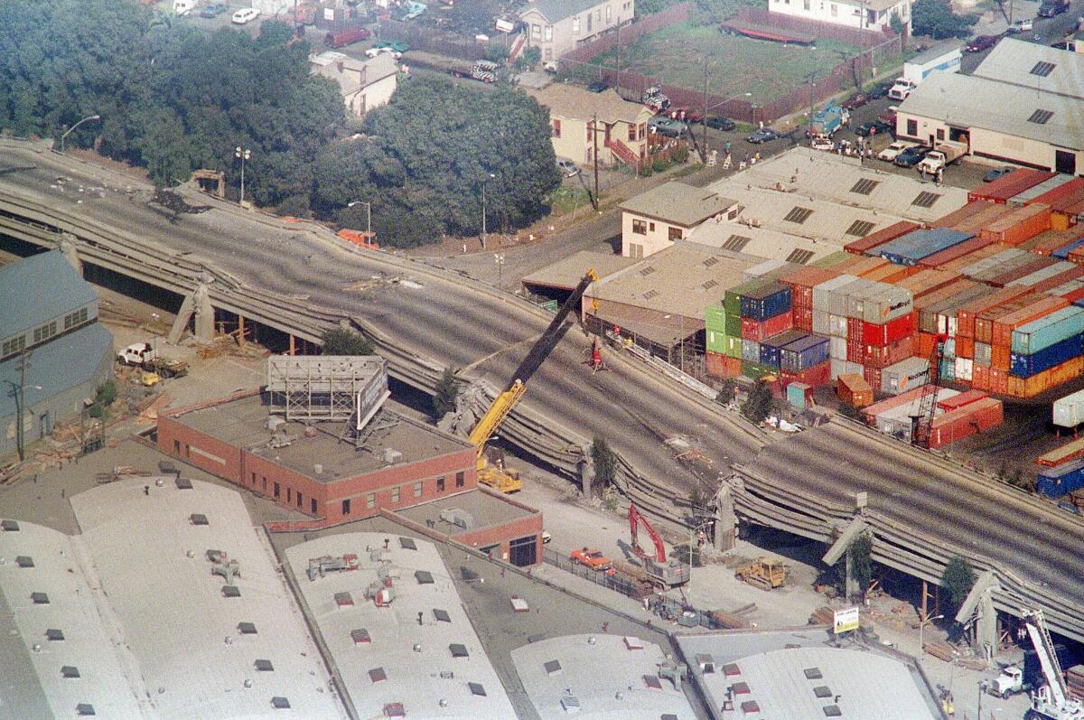 Cranes surround the Cypress Structure on Interstate 880 in Oakland after the 1989 temblor.