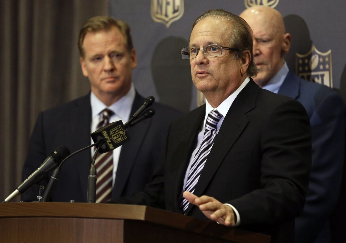 San Diego Chargers owner Dean Spanos, center, talks to the media as NFL Commissioner Roger Goodell looks on after team owners voted in 2016 to allow the Chargers to move to L.A.