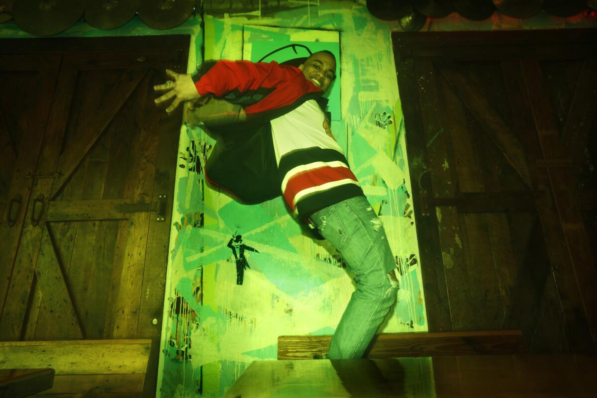 California born singer-rapper Anderson .Paak breaks a move while visiting one of his favorite bars in Koreatown, where he lives in Los Angeles, on Jan. 27, 2015.