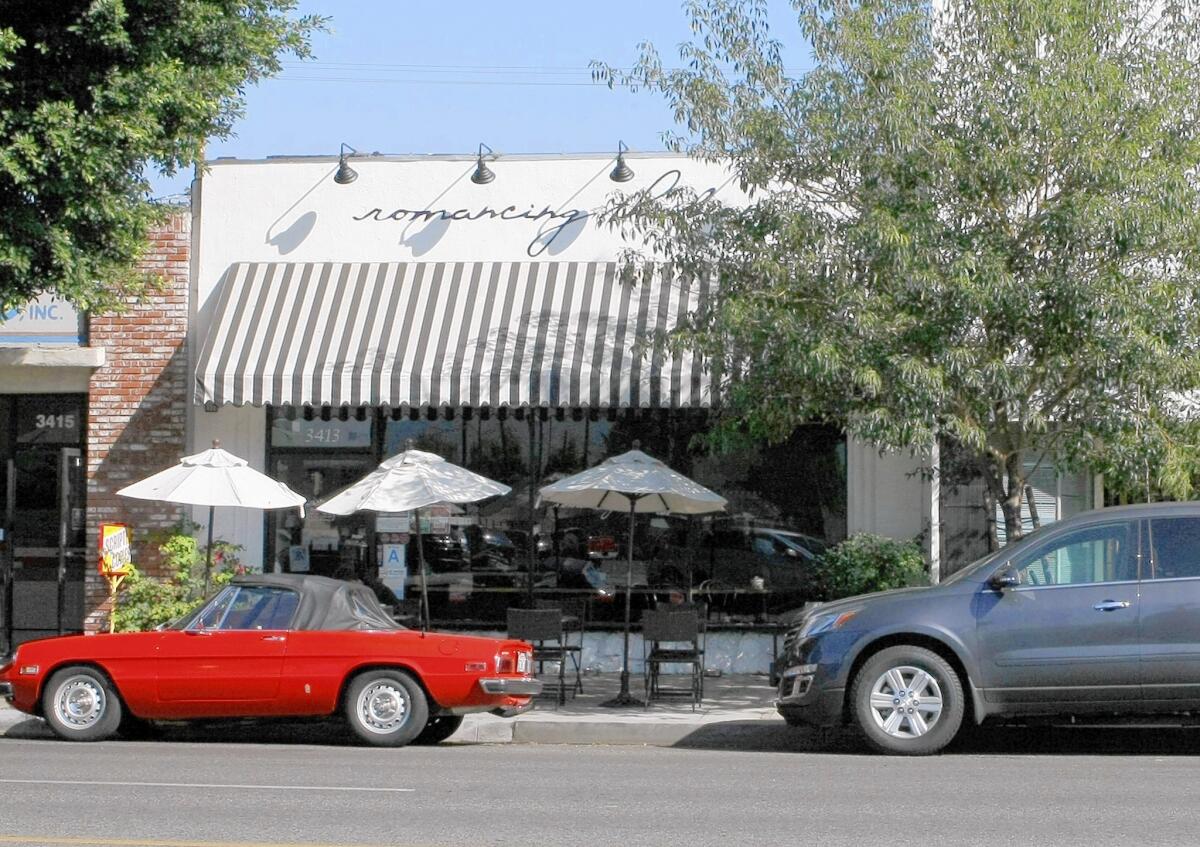 Cars parked in front of Romancing the Bean coffee shop on the 3400 block of W. Magnolia Ave. in Burbank on Thursday, Aug. 14, 2014. Some merchants around the coffee shop complain that cars belonging to the shop's customers stay parked too long.