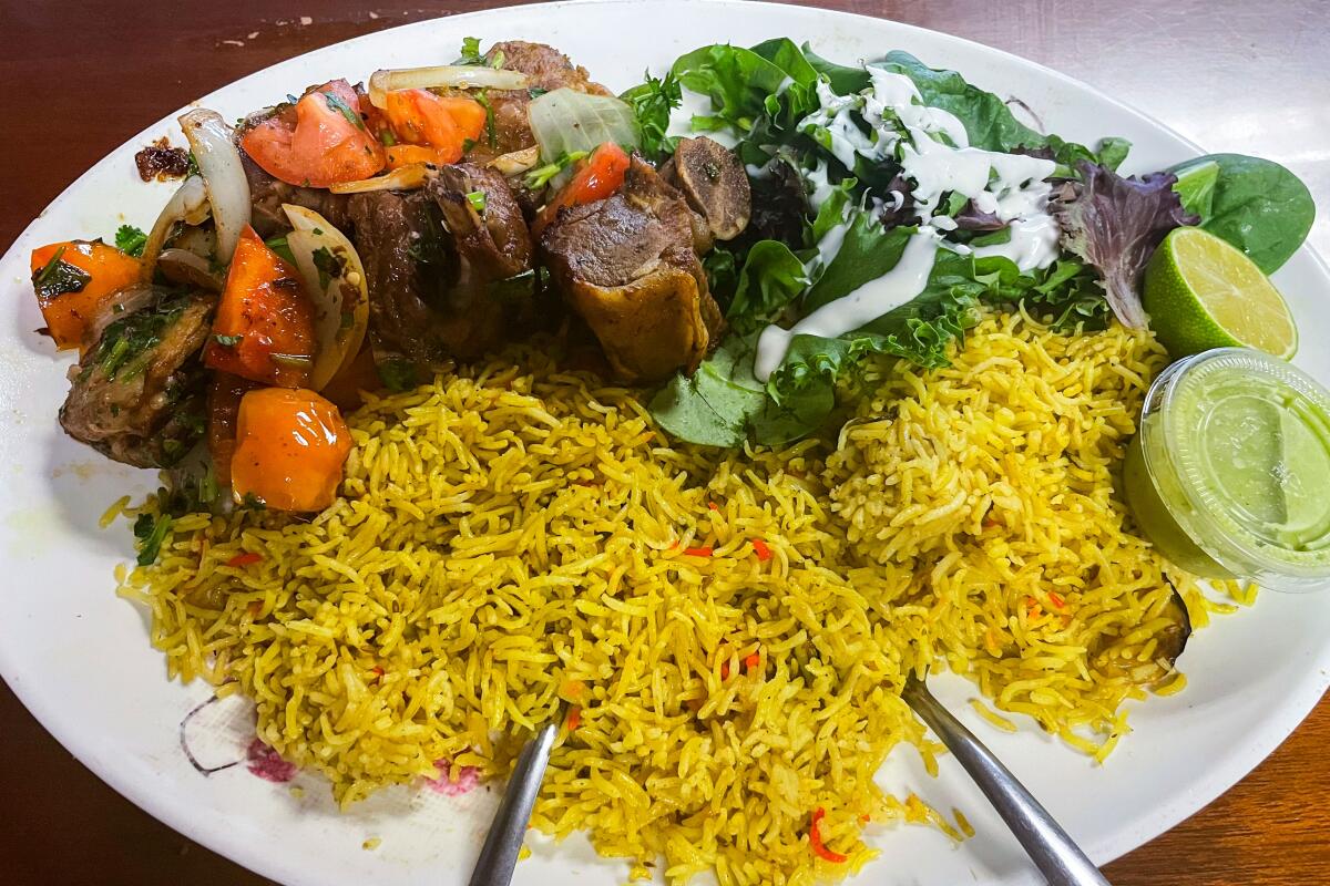 Banadir Somali's goat plate  includes rice and vegetables