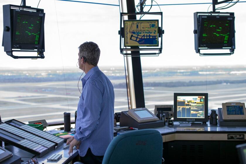 An air traffic controller works at Washington Dulles International Airport in 2016.