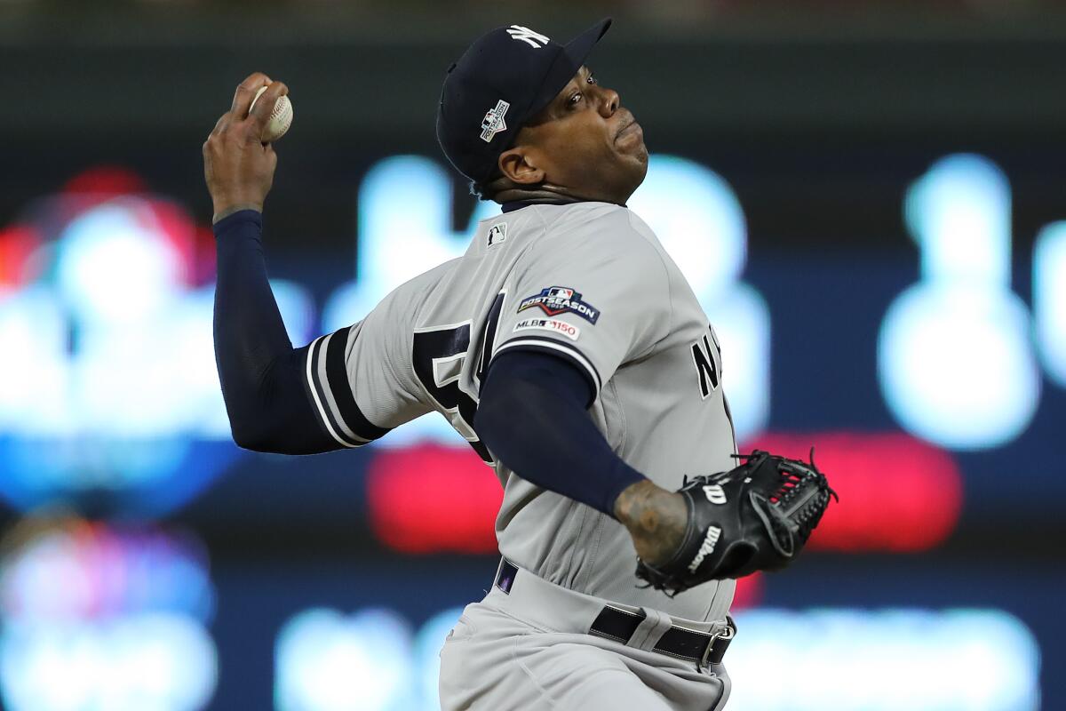 New York Yankees pitcher Aroldis Chapman delivers during the eighth inning of a 5-1 victory over the Minnesota Twins in Game 3 of the American League Division Series on Monday.