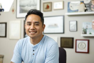 SAN DIEGO, CA - MAY 5: Author Minh Le has a new book out called "The Blur," show here at his La Mesa home on May 5, 2022. (K.C. Alfred / The San Diego Union-Tribune)